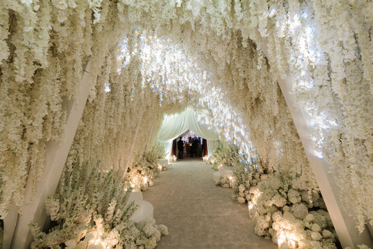 White Wedding with Immersive Floral Entrance Tunnel