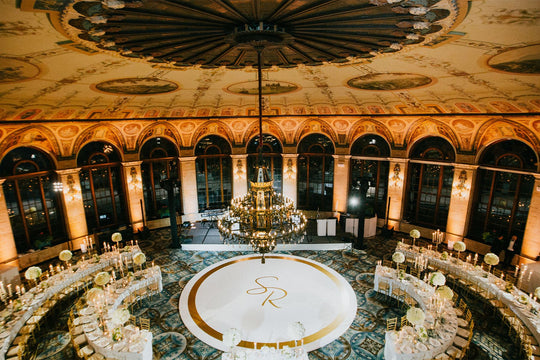 White Wedding Reception in the Round Incorporating Curved Dining Tables Surrounding a Circular Dance Floor